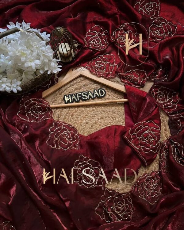 Women's Luxurious Maroon Shimmer Saree with Intricate Gold Zari/Threadwork & Scalloped Border – Complete with Blouse Piece for Festive & Wedding Wear - Image 7